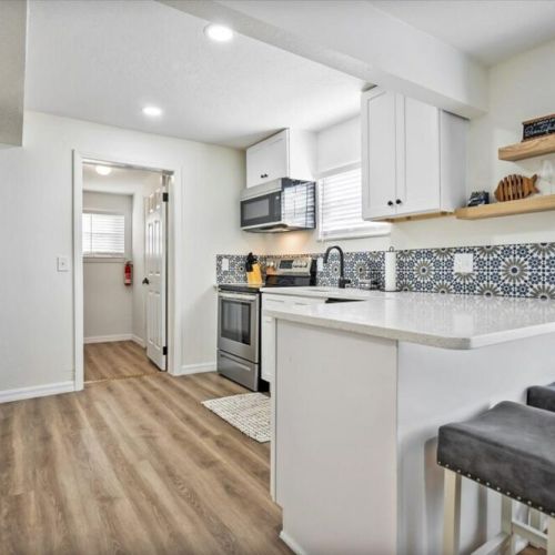 Fully remodeled kitchen and stocked kitchen with bar